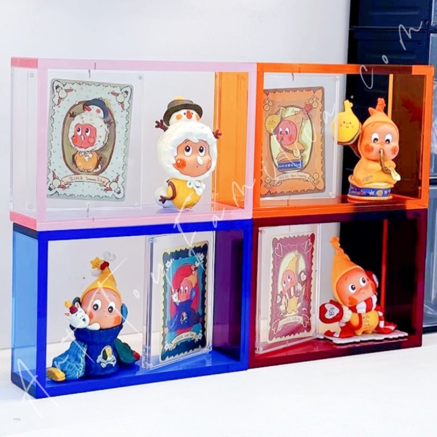 Rotating acrylic display case for a collectible figure