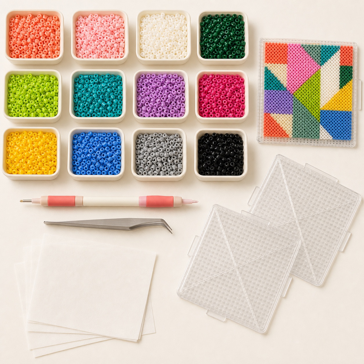 Fuse beads, pegboards, placement tools, and ironing paper arranged in a flat lay
